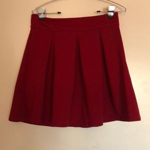 Pleated red mini skirt